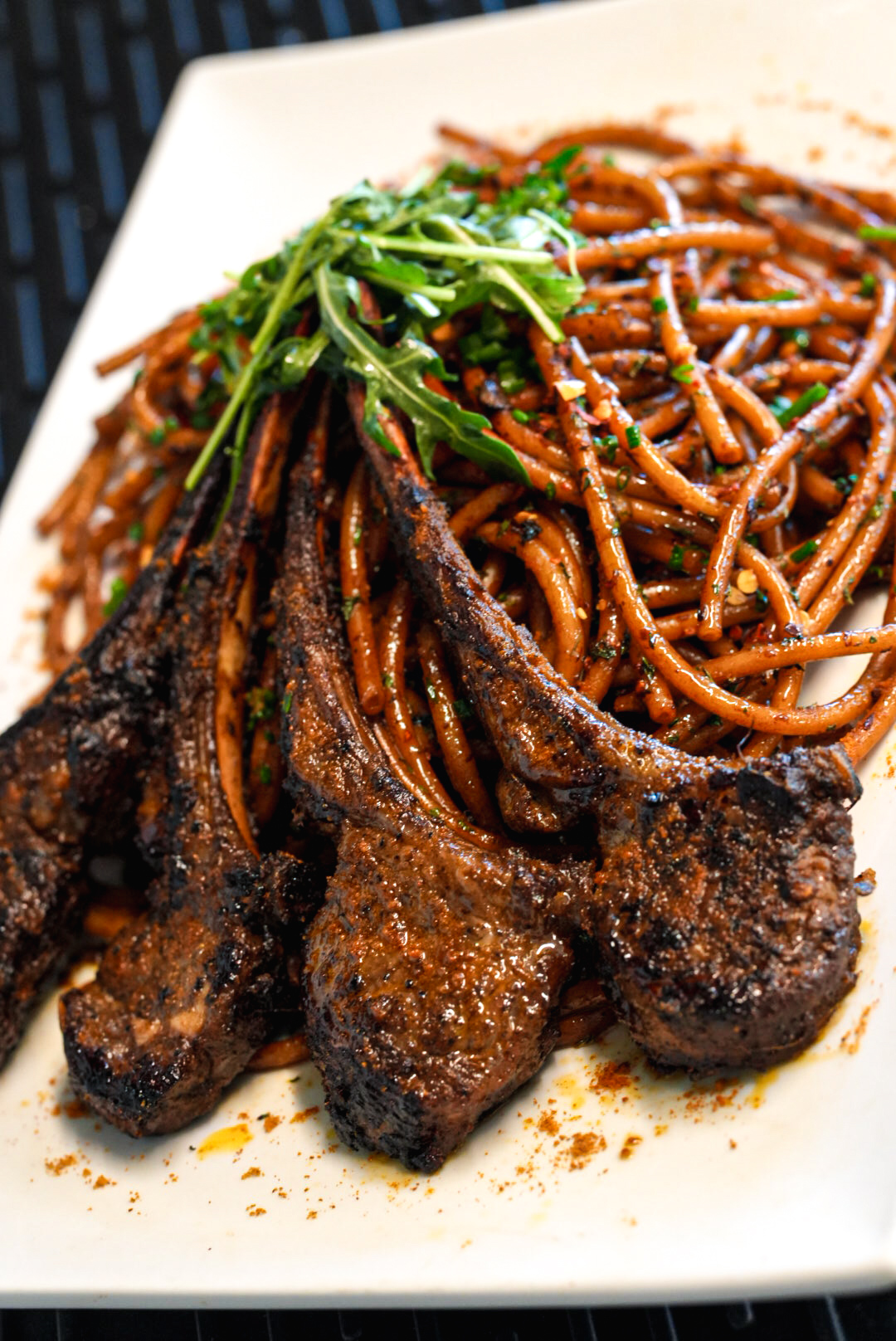 FloJoe's charred lamb chops over chili-spiced spaghetti with arugula