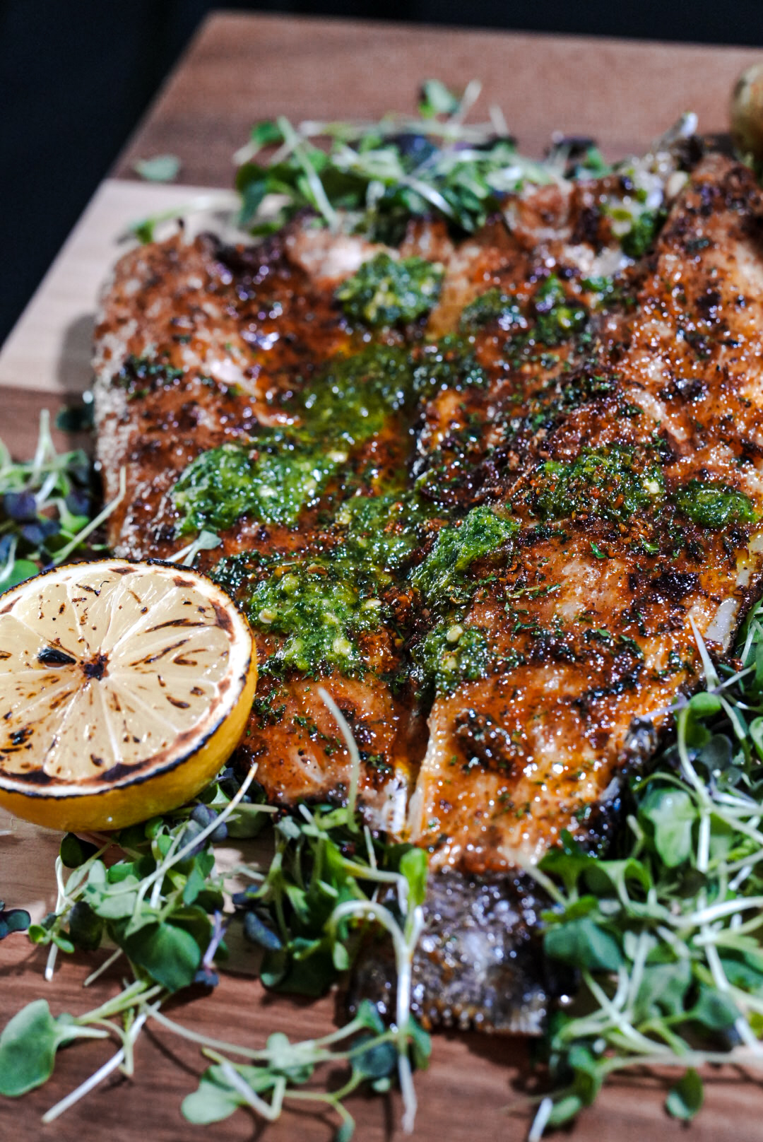 FloJoe's spice-rubbed branzino dressed with bright chimichurri and charred lemon