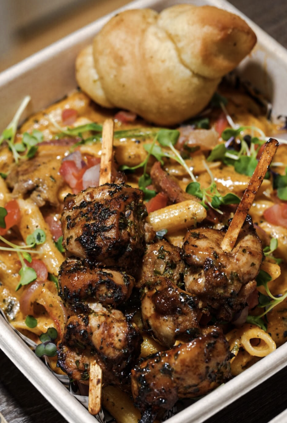 Creamy pasta loaded with grilled jerk chicken and fresh herbs